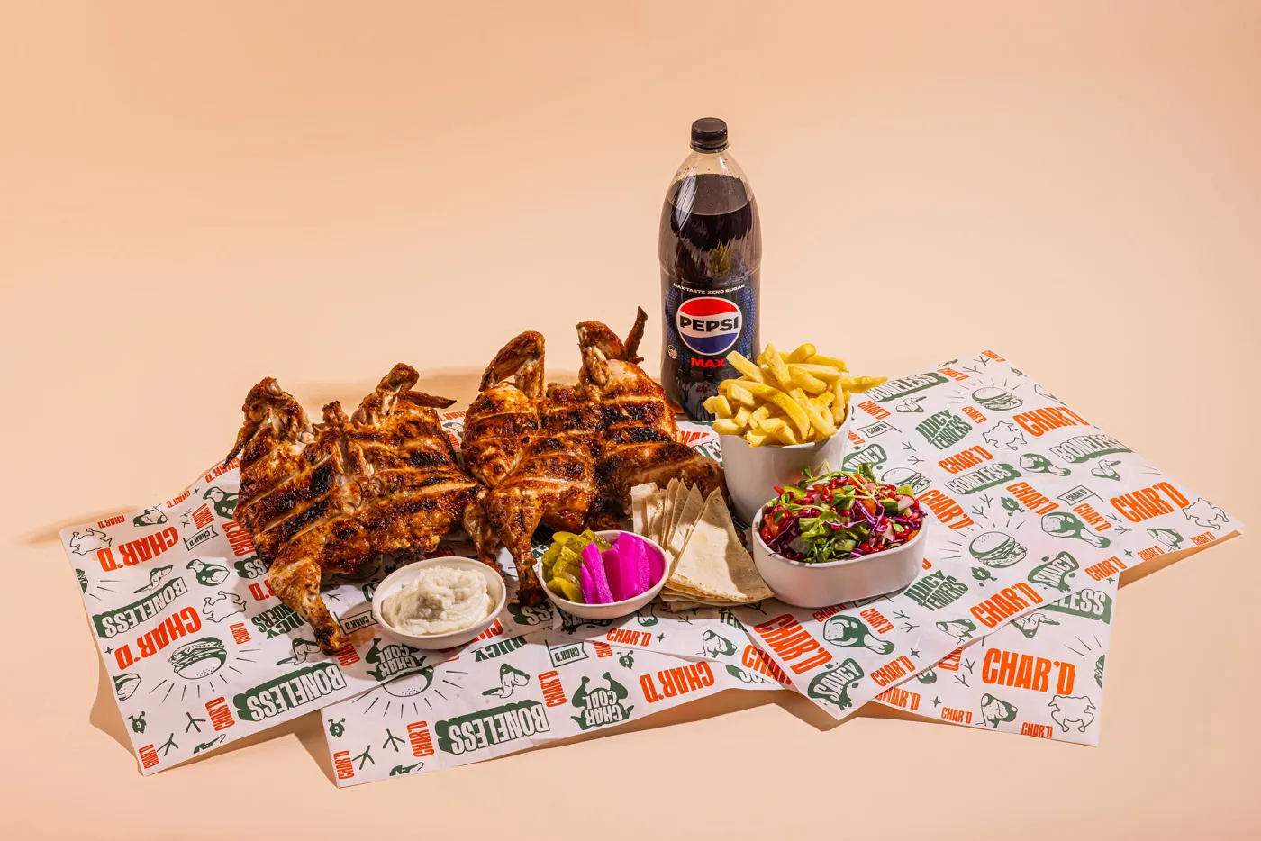 A Char’d feast of charcoal chickens, chips, salads, dips and drinks